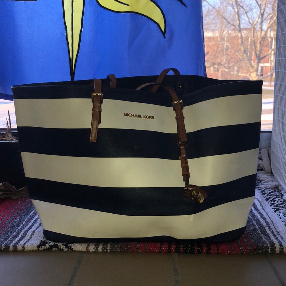Michael Kors nautical handbag. Navy blue and white with brown leather handles.